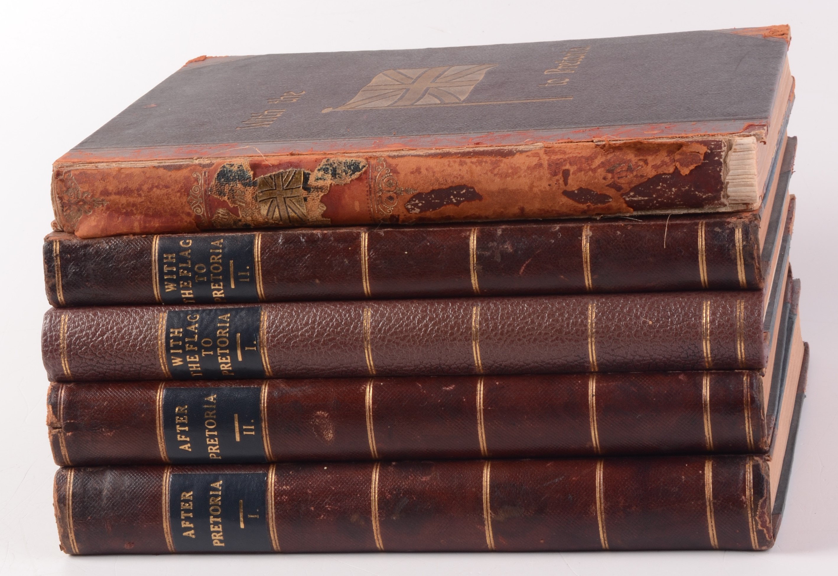 Five leather bound books, three entitled 'With The Flag To Pretoria' and 'After Pretoria' Vols.