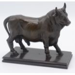 A continental cast iron figure of a bull, possibly Russian, 19th century, length 14cm, height 13cm.