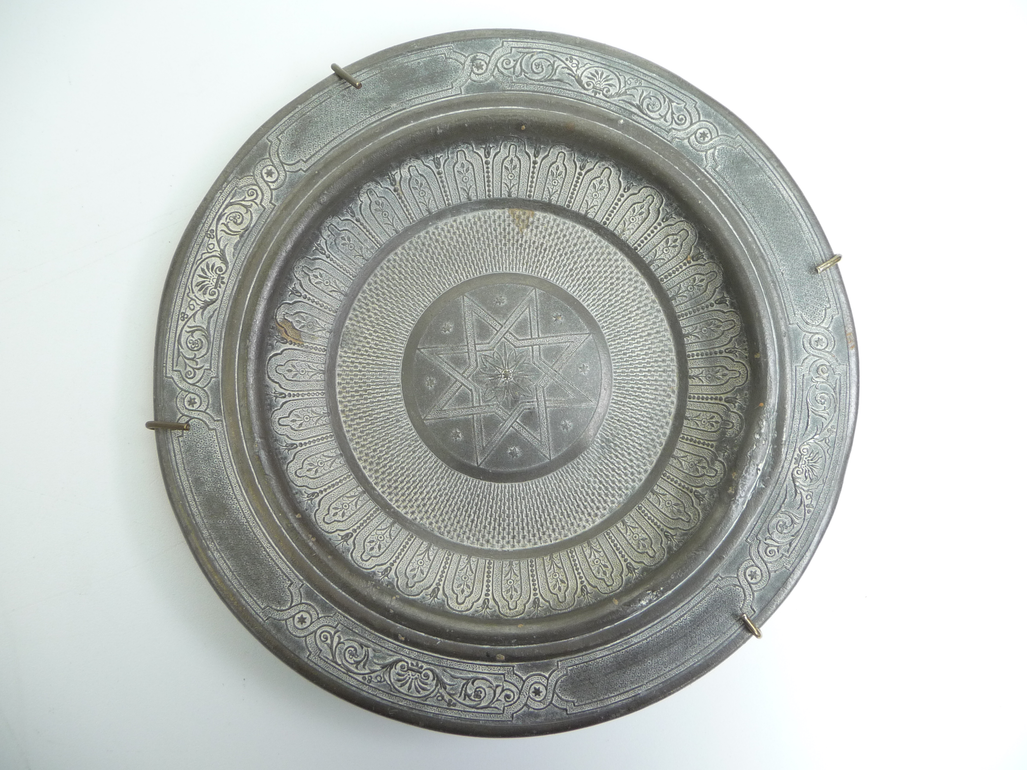 A pewter dish in 17th century style, to the centre Christ holds a flag and cross, - Image 4 of 5