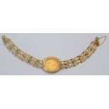 An Elizabeth II half sovereign, extremely fine, mounted in a 9ct gold gate link bracelet,