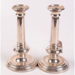 A pair of modern filled silver candlesticks in early 18th century style by M C Hersey & Son Ltd,