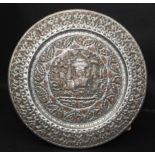 A large Indian white metal and copper circular tray, diameter 67cm.