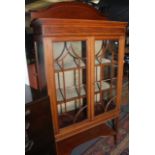 An Edwardian mahogany satinwood crossbanded and inlaid display cabinet.