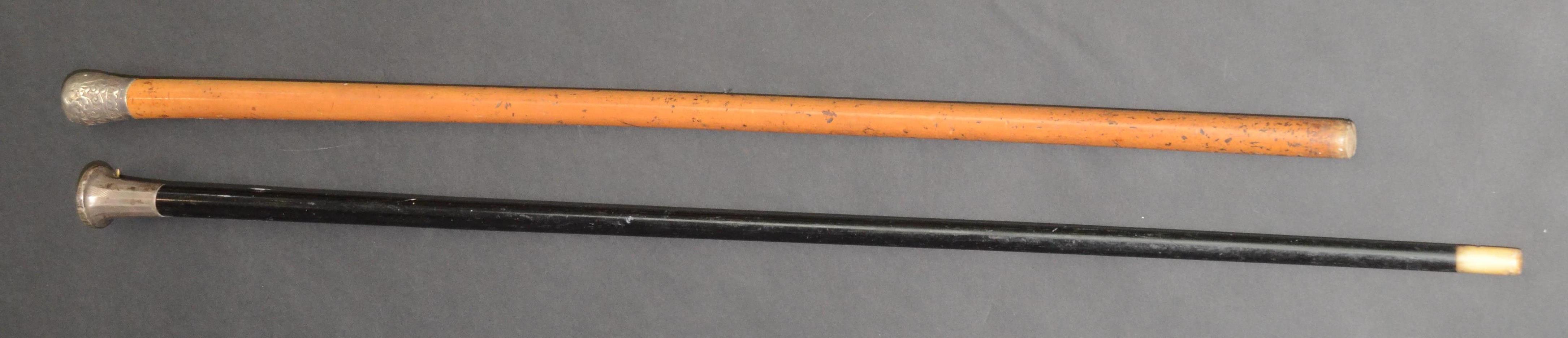 A malacca walking cane, with an Indian silver embossed top, length 84cm,