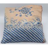 A Chinese silk embroidered cushion, decorated with chainstitch floral sprays and waves, 36 x 36cm.