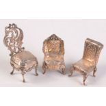 Three continental miniature silver chairs, each with import marks.