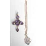 An Arts and Crafts style silver pendant set amethyst and one other amethyst and silver pendant.