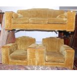 An early 20th century three seat sofa, upholstered in floral cut gold moquette,