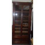 A tall Victorian mahogany glazed bookcase, height 222cm, width 100cm.