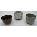 Three Studio Pottery tea bowls, height of largest 8.5cm.