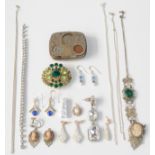 A nickel coin case and costume jewellery.