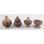 Khmer ceramics, four 12th-13th century brown glaze pots, heights 8.5cm, 7.7cm, 7.2cm and 4.3cm.