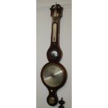 A George III inlaid mahogany wheel barometer, with three circular silvered dials,