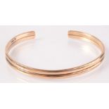 A 9ct gold slave bangle, 16.7g.