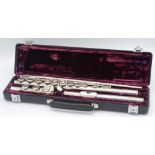 A flute in a fitted velvet case, inscribed 'Buffet Crampon Paris, cooper scale, ARC E', No. 228.