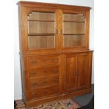 A continental light oak cabinet,