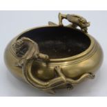 A Chinese brass incense burner with chi lin ornamental handles, Xuande six character mark to base,