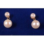 A pair of Mikimoto pearl earrings. Condition report: No damage.