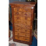 A Victorian mahogany veneered Wellington chest of eight graduated drawers, width 65cm, height 124.