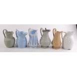Six Victorian moulded jugs, one with pewter cover, height 23cm.