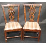 A set of four country made Chippendale style dining chairs.