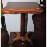 An mahogany occasional table on an octagonal pedestal.