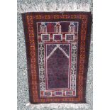 A Belouch prayer rug, the brown mihrab filled with polychromes guls, within three borders,