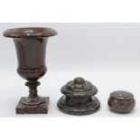 A Cornish serpentine inkwell, a campana shaped red serpentine urn,
