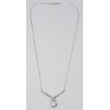An 18ct white gold and diamond wishbone necklace, 6.8g.