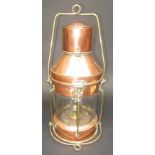 A copper ship's lamp with burner, height 52cm.