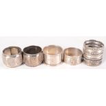 Seven silver napkin rings.