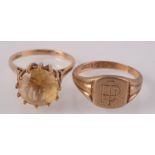 A 9ct gold post war ring set a citrine and a 9ct gold signet ring.