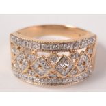 A 9ct gold ornate ring set many small diamonds. Condition report: 4.