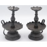 A pair of Dutch style pewter pricket candlesticks, height 17.5cm.