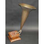 A gramophone, width 35cm, with a huge brass horn, length 84cm.