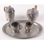 A Liberty & Co 'Tudric' pewter tea service, circa 1920, comprising teapot, hot water jug,