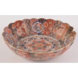 A Japanese porcelain Imari oval bowl, the fluted body with gilt floral decoration,