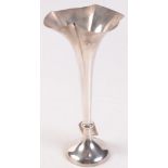 A tall Edwardian fluted silver spill with filled base, London 1905, height 32cm.