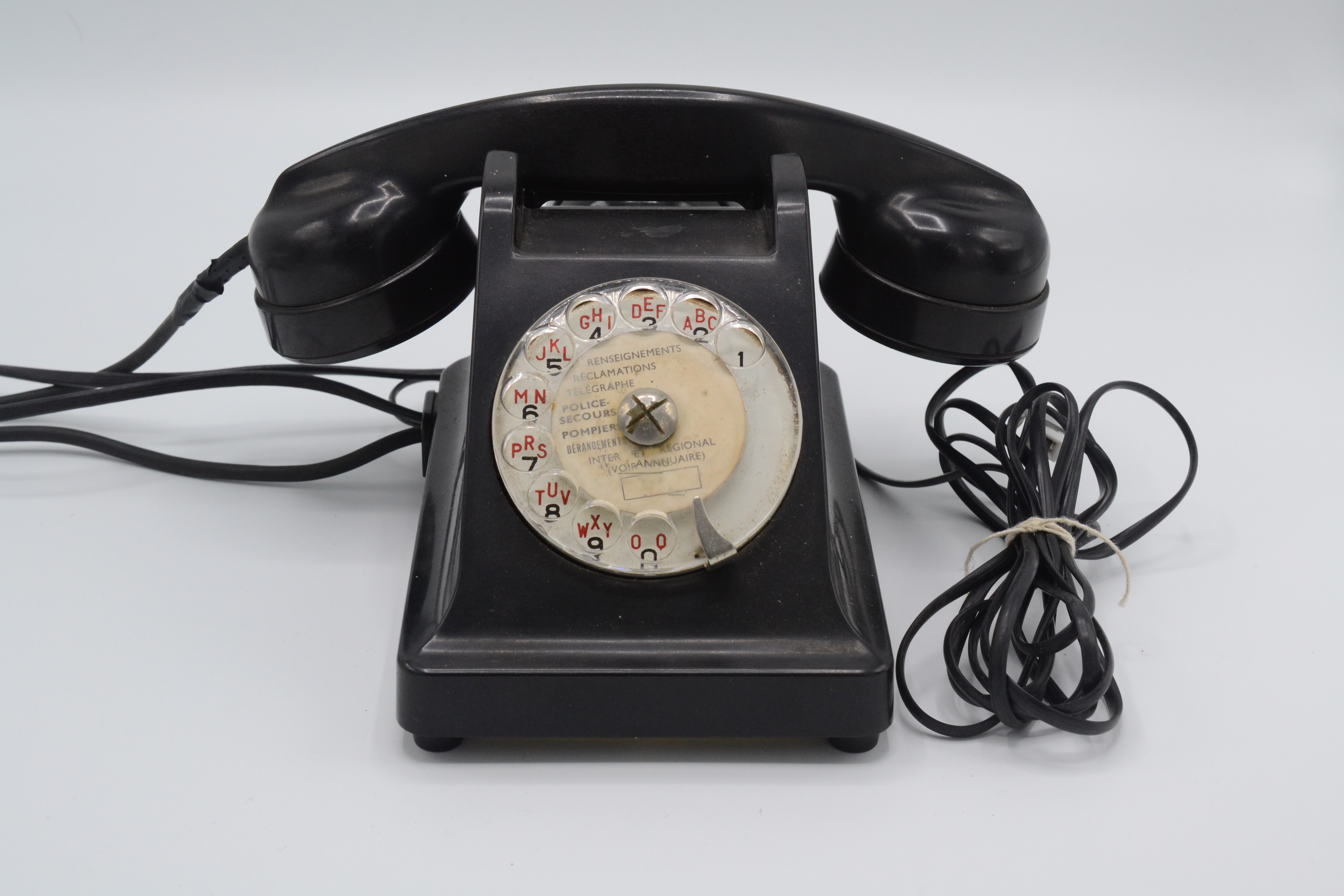 A French black bakelite telephone, height 13.5cm.