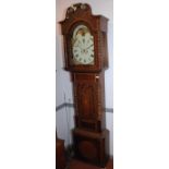 A George III oak inlaid eight day long case clock, the painted dial with revolving lunar arch,