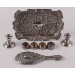 A dressing table tray, four silver napkin rings etc.