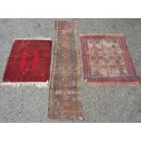 An Afghan rug, the red field with three octagonal medallions, 136 x 106cm, a worn Afshar rug,