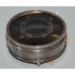 A silver cylindrical ring box with pique lid.