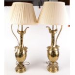 A pair of impressive Aesthetic Movement brass table lamps of ewer form.