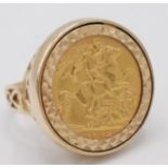 A ring set a George V 1914 half sovereign, 9.1g.