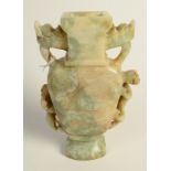 A Chinese mottled green and brown jade, two handled vase of flattened baluster form,