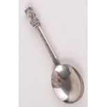 A silver plated spoon, with religious symbols, length 23.5cm.