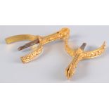 A pair of gilt metal military spurs, decorated with thistles and foliage, by Maxwell,