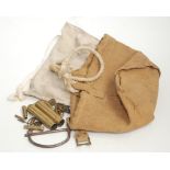 A kit bag steel locking clip, and various brass cartridge cases etc in a canvas bag,