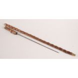 A steel sword stick, in a wooden scabbard, total length 91cm.